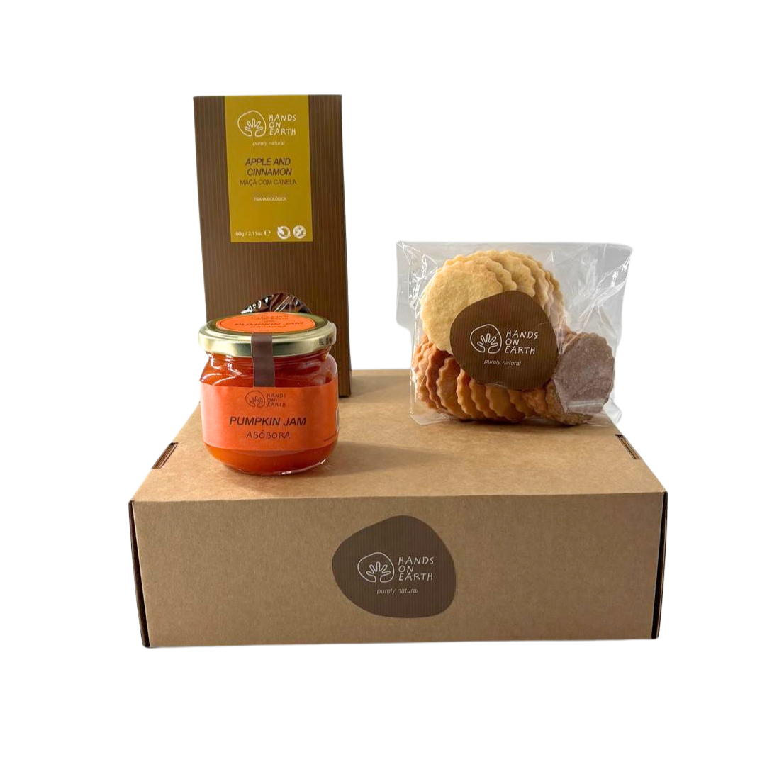 Cabaz presente premium Hands on Earth com compota artesanal de abóbora, tisana biológica de maçã com canela e bolachas artesanais variadas