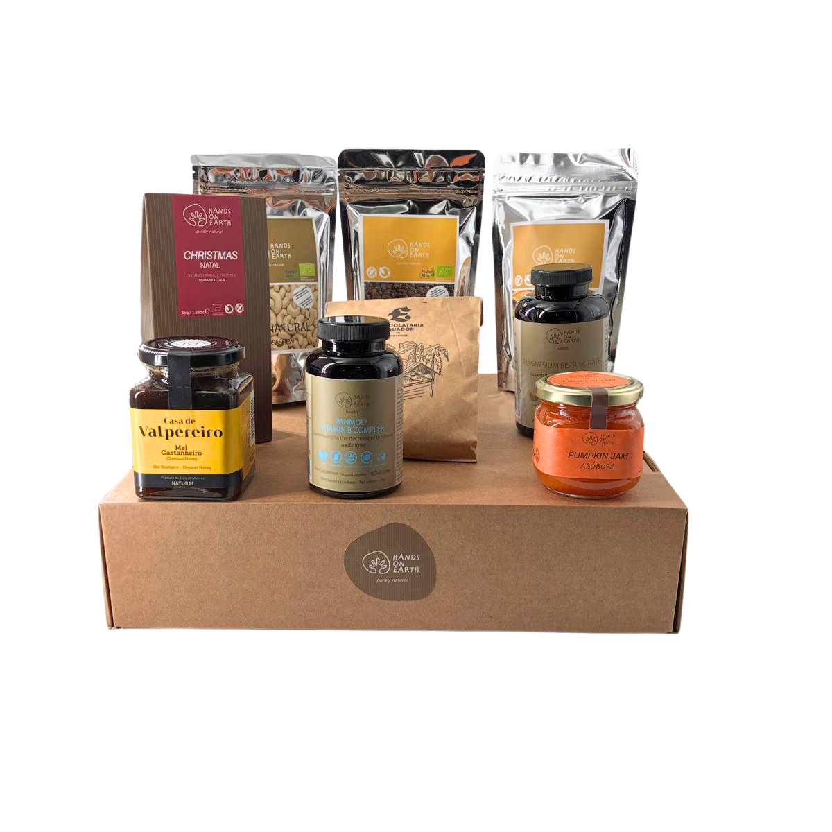 Cabaz de Natal Premium Hands on Earth com tisana de Natal biológica, compota de abóbora, uvas-passas e castanhas de caju biológicas, chocolate em pó para chocolate quente, mel de castanheiro biológico, maçã desidratada, suplementos alimentares e caixa premium com logótipo Hands on Earth