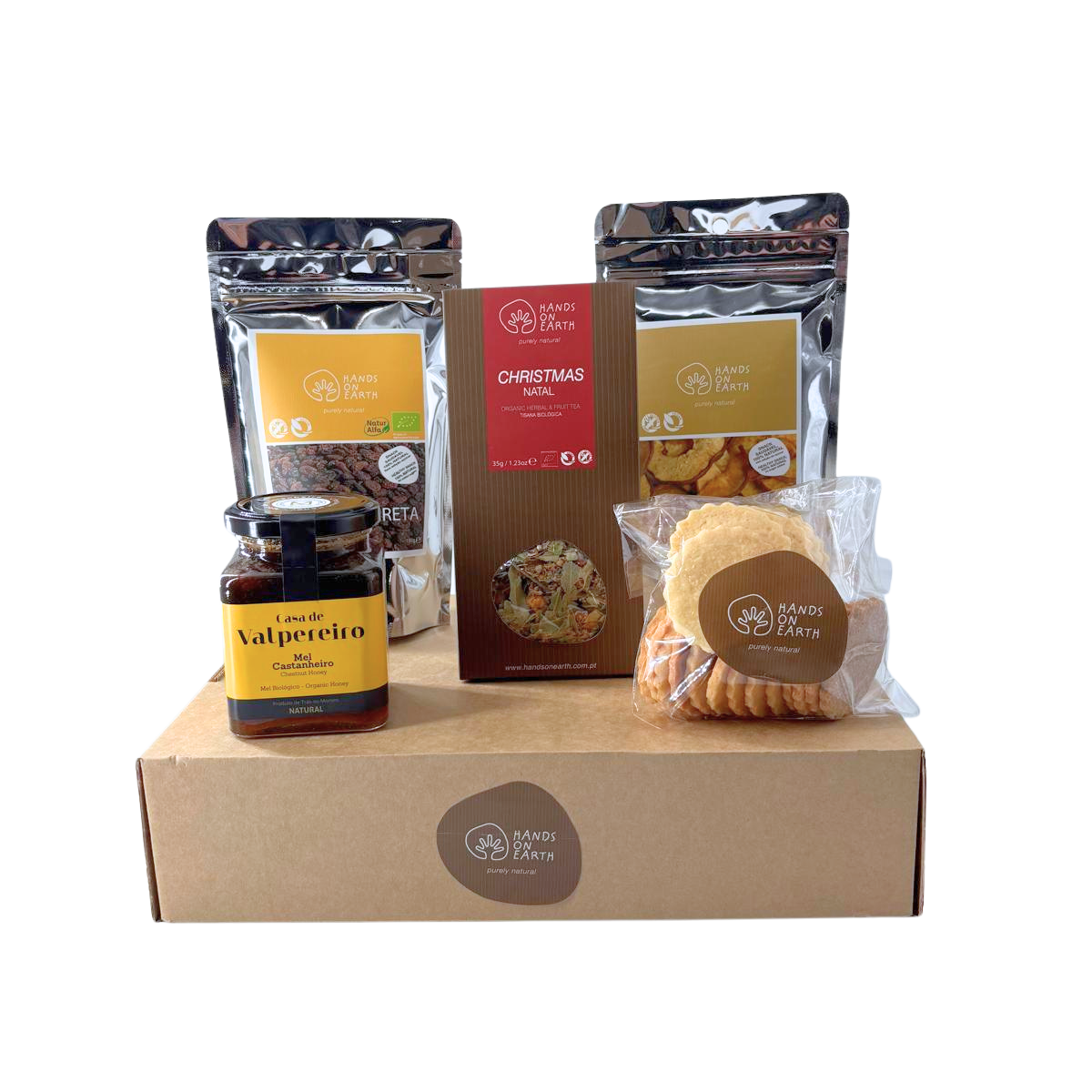 Cabaz de Natal Premium Hands on Earth com tisana de Natal biológica, mel de castanheiro biológico, bolachas artesanais, uvas-passas biológicas e maçã desidratada